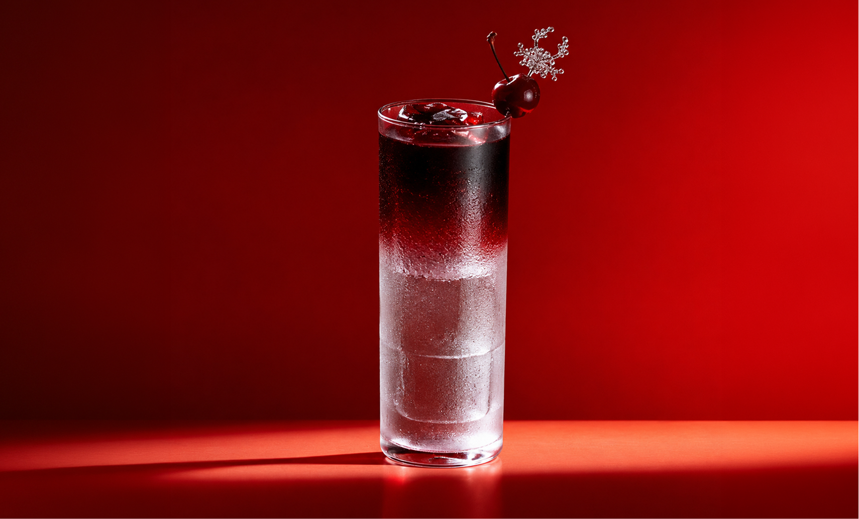 Veenus Fizz cocktail on a red backdrop