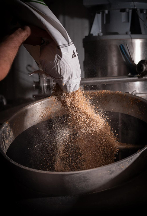 Pouring grain into the still